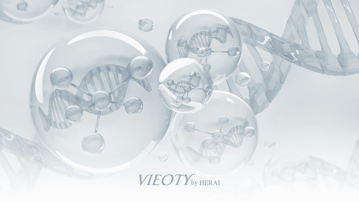 VIEOTYハーモニーウォッシュのボトルから流れ出る一滴の中に、アミノ酸の分子構造式が美しくきらめいている様子のイメージ画像。